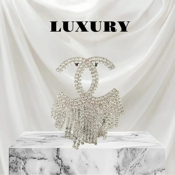 This exquisite rhinestone brooch is a stunning accessory to any outfits